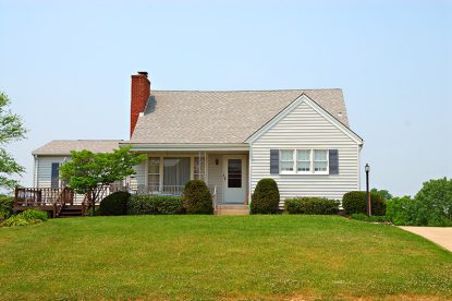 The exterior of a home on a bright summer day.